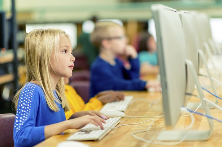 girl on computer education exchange